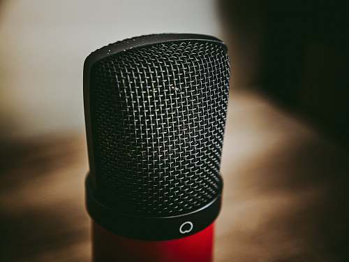 microphone black and red microphone on brown wooden table mic